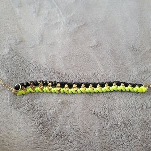 Black,lime green and gold bracelet.